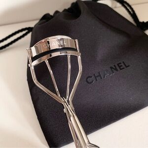 Hold NWOT Chanel eyelash curler with drawstring dust pouch